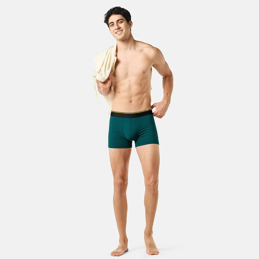 Full-length model photograph wearing Marina teal trunks